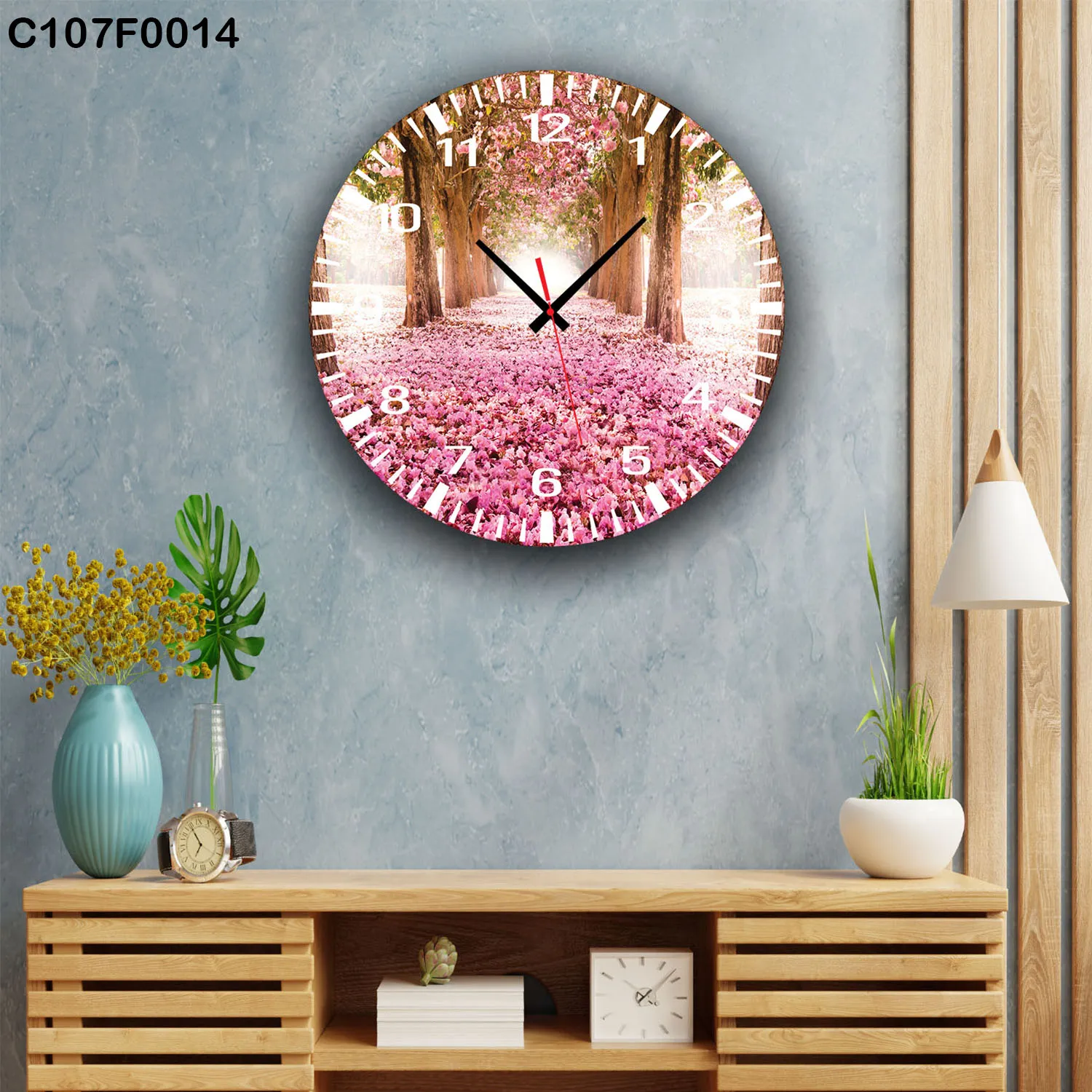 ساعة دائرية ممشى أشجار زهور وردية